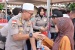 Polda Kepri Berbagi Asih Buka Puasa Bersama Masyarakat Nongsa 